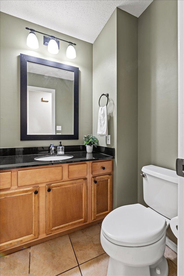 6491 Regency Ln, Eden Prairie, MN 55344 - half bath featuring vanity, a textured ceiling, and tile patterned flooring