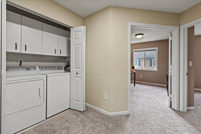 6491 Regency Ln, Eden Prairie, MN 55344 - laundry room featuring cabinet space, independent washer and dryer, and light carpet