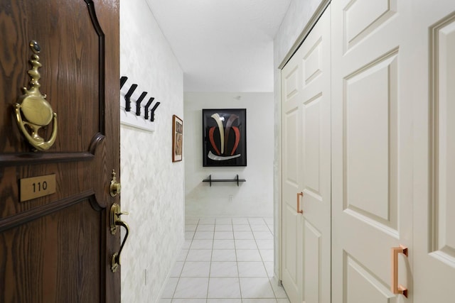 corridor featuring light tile patterned flooring