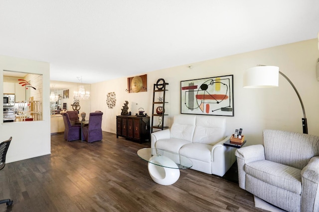 living area with a chandelier and dark wood-style flooring