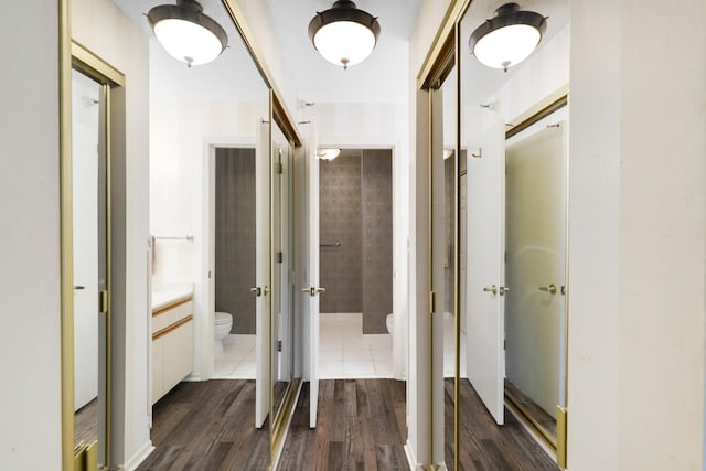 corridor with dark wood finished floors