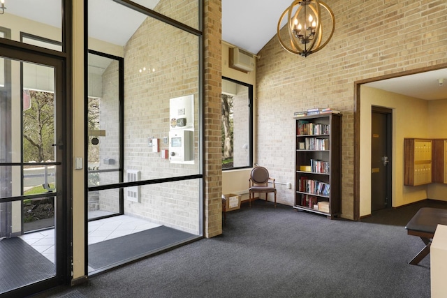 building lobby with high vaulted ceiling and brick wall
