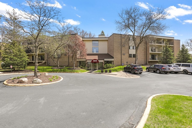 view of property with uncovered parking