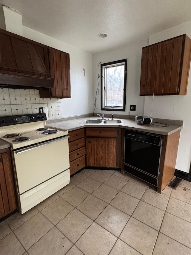 kitchen with light countertops, dishwasher, a sink, white range with electric cooktop, and tasteful backsplash