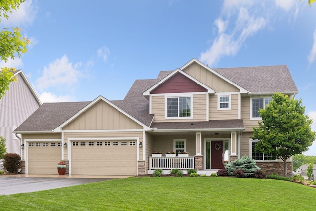 3209 Symphony Ct, Chaska, MN 55318 - craftsman-style house with board and batten siding, covered porch, a shingled roof, a garage, and a front lawn