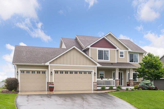 3209 Symphony Ct, Chaska, MN 55318 - craftsman-style home featuring covered porch, board and batten siding, asphalt driveway, an attached garage, and a front lawn