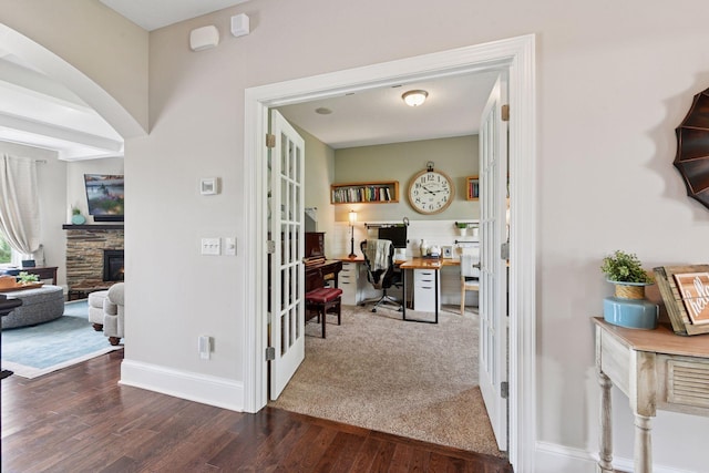 3209 Symphony Ct, Chaska, MN 55318 - hallway with wood finished floors, an office area, and arched walkways