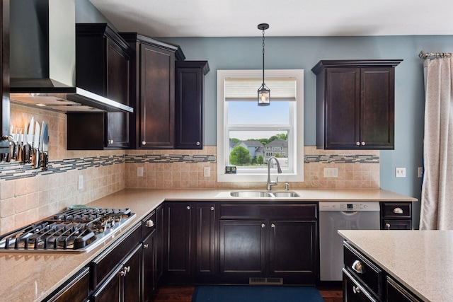3209 Symphony Ct, Chaska, MN 55318 - kitchen with wall chimney exhaust hood, appliances with stainless steel finishes, decorative light fixtures, tasteful backsplash, and dark brown cabinetry