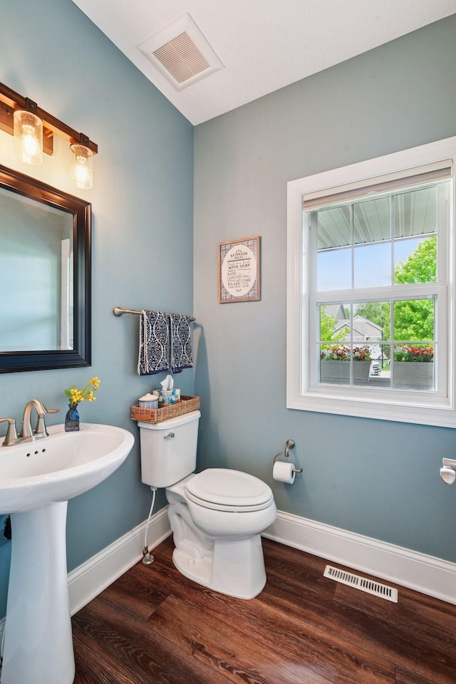 3209 Symphony Ct, Chaska, MN 55318 - half bath featuring wood finished floors and toilet