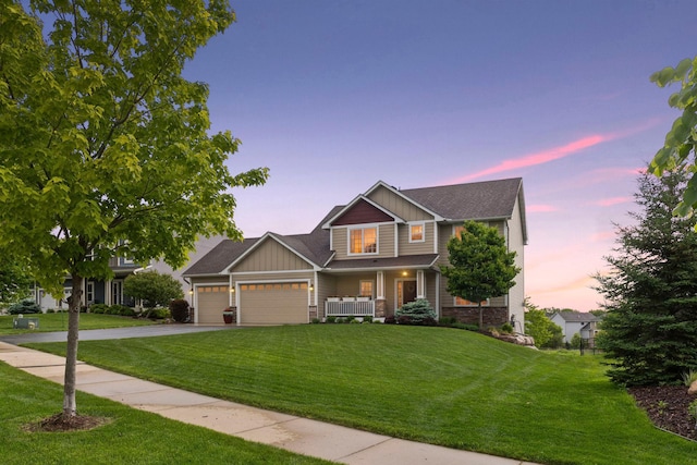 3209 Symphony Ct, Chaska, MN 55318 - craftsman-style home featuring an attached garage, driveway, a front yard, and board and batten siding