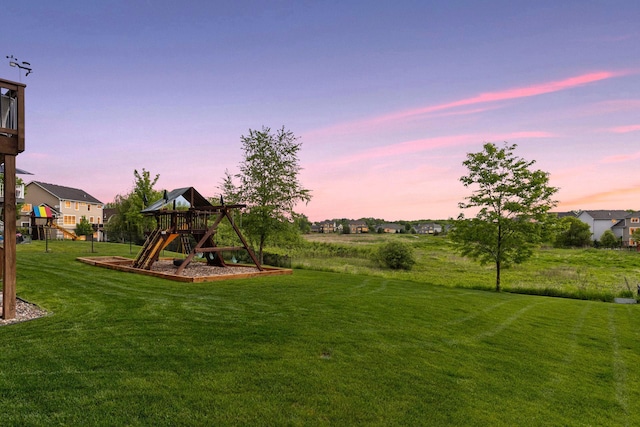 3209 Symphony Ct, Chaska, MN 55318 - yard at dusk with a playground and a lawn