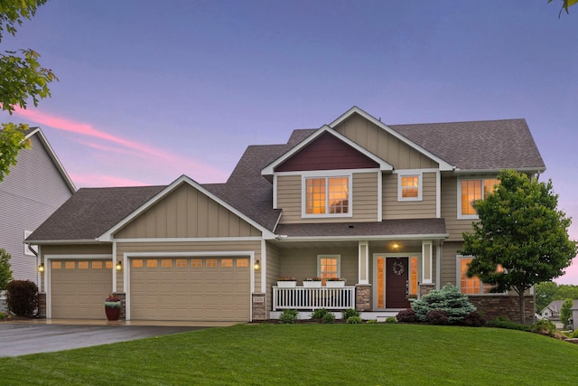 3209 Symphony Ct, Chaska, MN 55318 - craftsman inspired home with covered porch, board and batten siding, a garage, and a lawn
