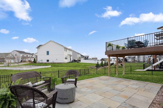 view of patio featuring fence and a residential view