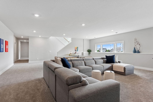 living room featuring baseboards, recessed lighting, light carpet, and a textured ceiling