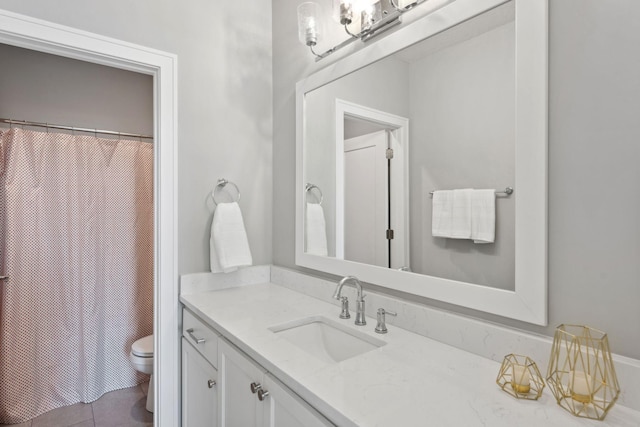 bathroom featuring vanity, toilet, and a shower with shower curtain