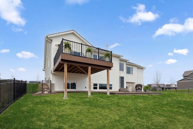 back of house with a fenced backyard, a wooden deck, and a lawn
