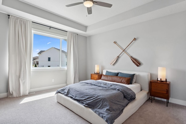 bedroom featuring carpet, a ceiling fan, and baseboards