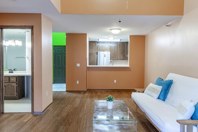 living room featuring baseboards and wood finished floors