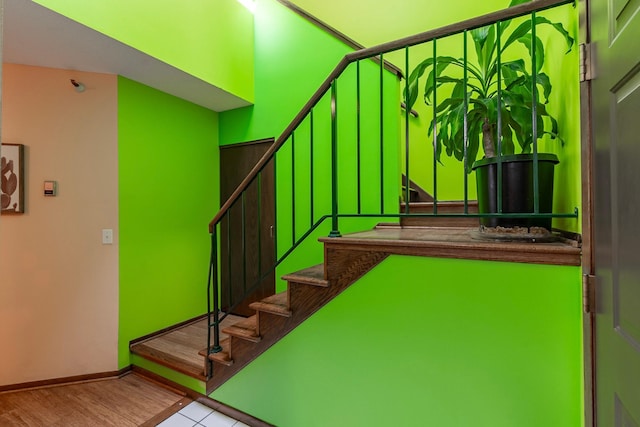 staircase featuring baseboards
