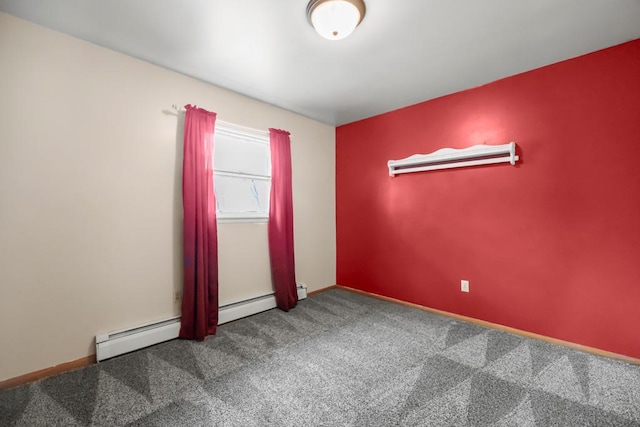 empty room featuring baseboards and carpet floors