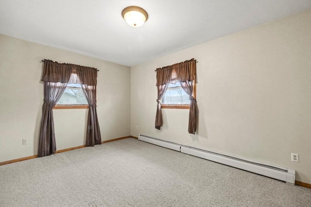 unfurnished room with carpet flooring, a healthy amount of sunlight, baseboards, and a baseboard radiator