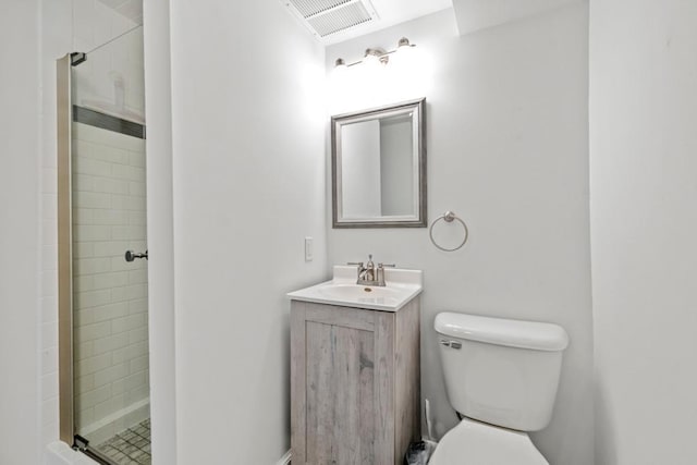 full bathroom featuring visible vents, a shower stall, toilet, and vanity