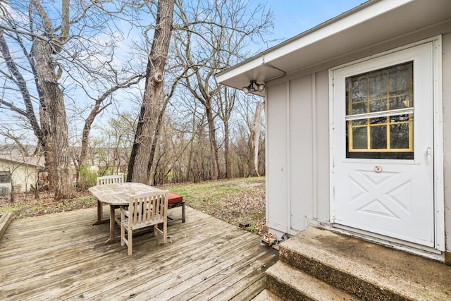 deck featuring outdoor dining space and entry steps