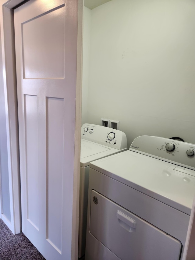 laundry area with carpet, separate washer and dryer, and laundry area