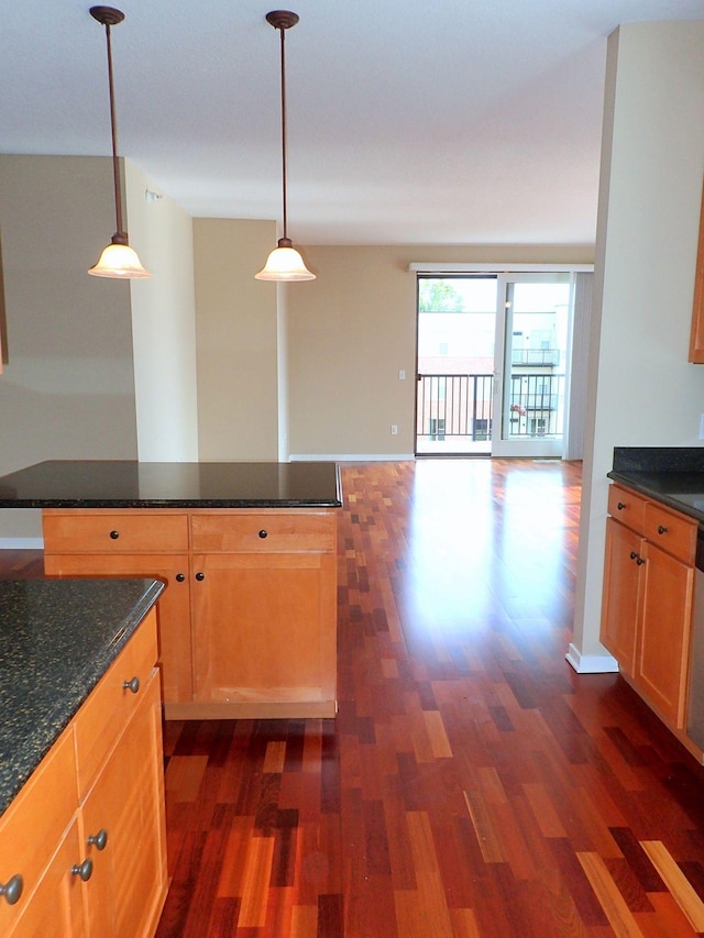 1070 Grandview Ct NE Unit 413, Columbia Heights, MN 55421 - kitchen featuring decorative light fixtures, dark wood finished floors, baseboards, and open floor plan