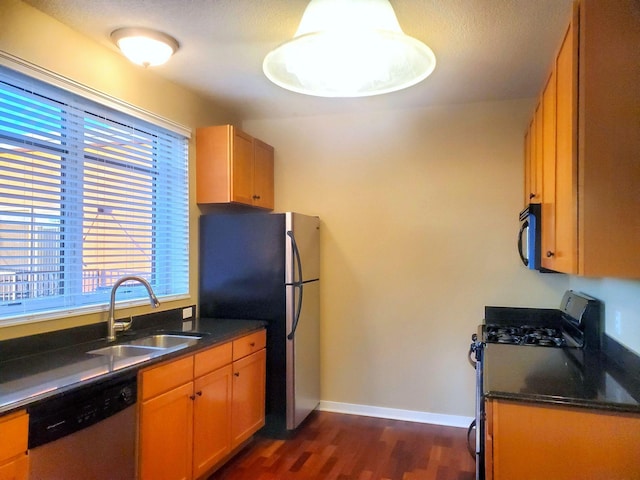 1070 Grandview Ct NE Unit 413, Columbia Heights, MN 55421 - kitchen featuring dark wood-type flooring, baseboards, stainless steel appliances, and a sink