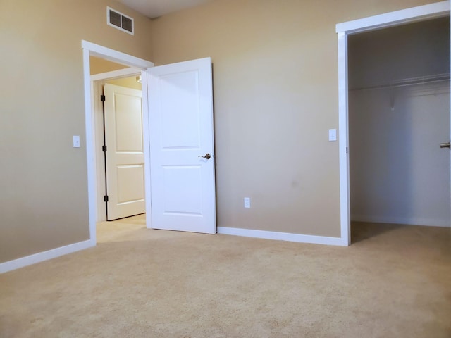 1070 Grandview Ct NE Unit 413, Columbia Heights, MN 55421 - unfurnished bedroom featuring light colored carpet, baseboards, visible vents, and a closet