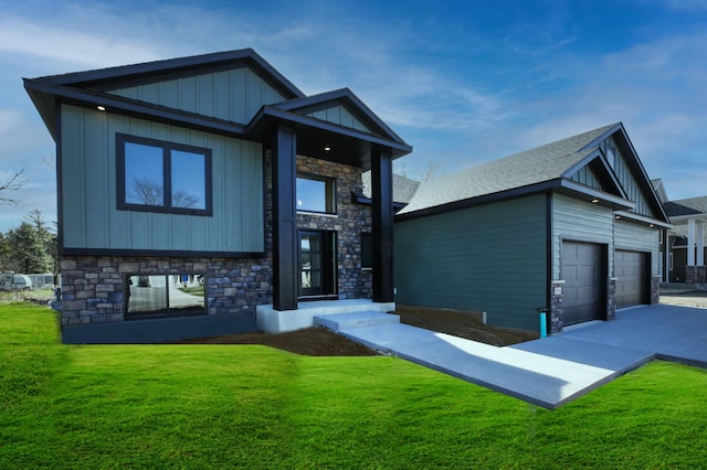 1504 14th Ave NE, Kasson, MN 55944 - view of front of house with a front yard, stone siding, a garage, driveway, and a shingled roof