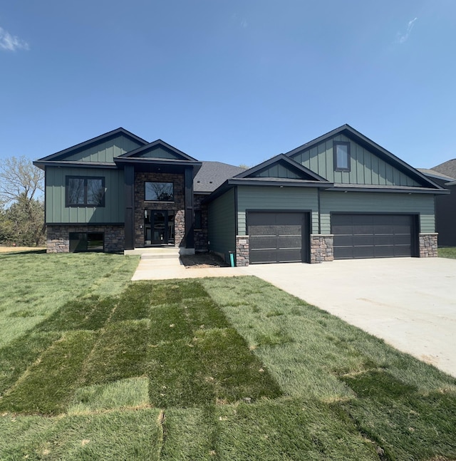 1504 14th Ave NE, Kasson, MN 55944 - view of front facade featuring board and batten siding, stone siding, and a front yard