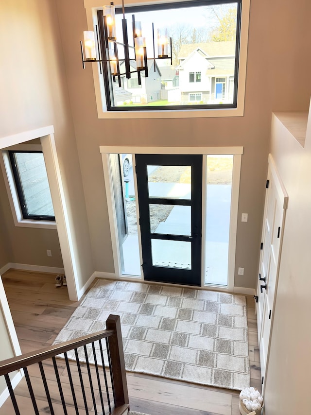 1504 14th Ave NE, Kasson, MN 55944 - entryway with baseboards, healthy amount of natural light, and a high ceiling
