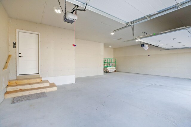 1504 14th Ave NE, Kasson, MN 55944 - garage featuring a garage door opener