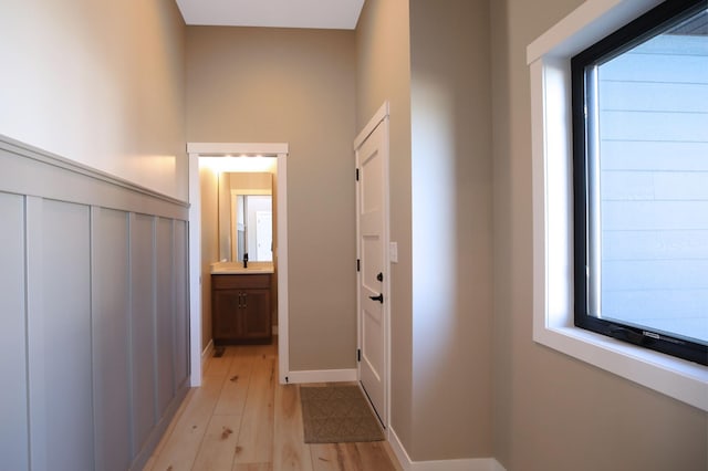 1504 14th Ave NE, Kasson, MN 55944 - entryway with light wood-style flooring, plenty of natural light, and baseboards