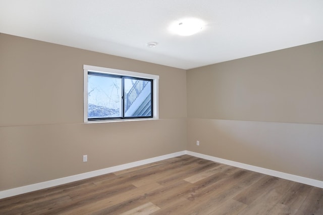 1504 14th Ave NE, Kasson, MN 55944 - spare room featuring baseboards and wood finished floors