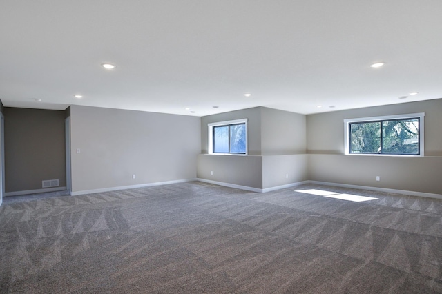 1504 14th Ave NE, Kasson, MN 55944 - empty room with carpet, plenty of natural light, baseboards, and recessed lighting