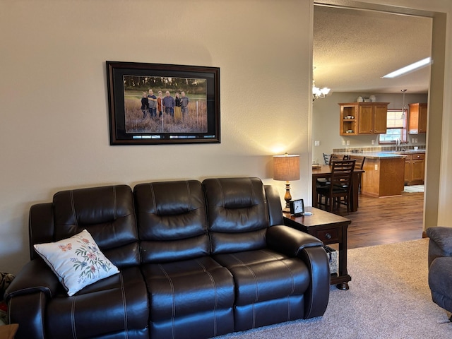 154 Pond Dr, Jackson, MN 56143 - living area with a chandelier and carpet