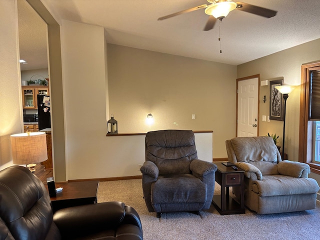 154 Pond Dr, Jackson, MN 56143 - carpeted living room featuring ceiling fan and baseboards