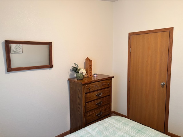 154 Pond Dr, Jackson, MN 56143 - bedroom featuring baseboards