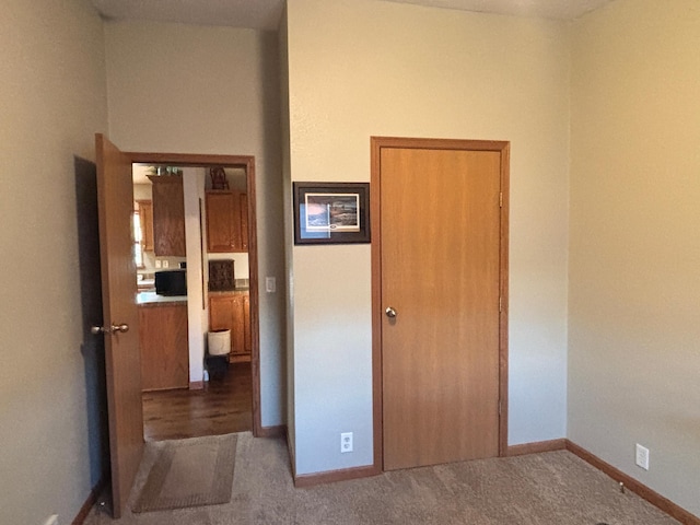 154 Pond Dr, Jackson, MN 56143 - unfurnished bedroom with carpet floors and baseboards