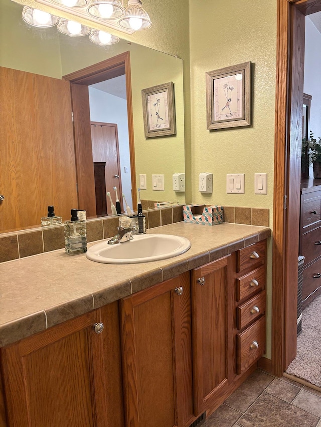154 Pond Dr, Jackson, MN 56143 - bathroom featuring vanity and a textured wall