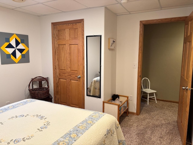 154 Pond Dr, Jackson, MN 56143 - bedroom featuring carpet flooring, a paneled ceiling, and baseboards