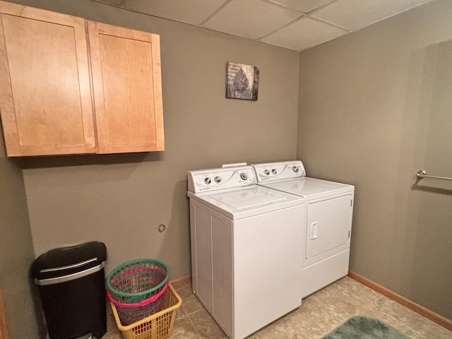 154 Pond Dr, Jackson, MN 56143 - laundry room featuring cabinet space, baseboards, and separate washer and dryer