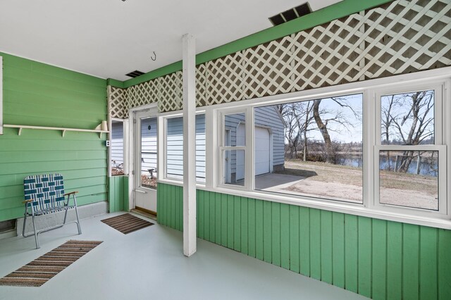 view of patio / terrace with a water view and visible vents