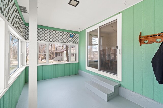 unfurnished sunroom with plenty of natural light