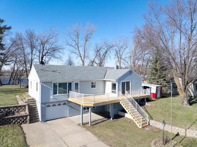 view of front of house with a garage, roof with shingles, a wooden deck, and stairway