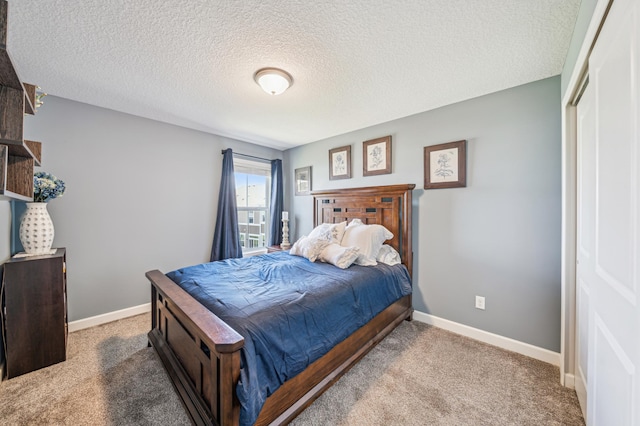 4271 Corn Silk Ln, Woodbury, MN 55129 - carpeted bedroom with a textured ceiling, baseboards, and a closet