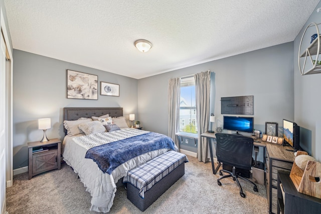 4271 Corn Silk Ln, Woodbury, MN 55129 - bedroom with carpet floors, baseboards, a desk, and a textured ceiling